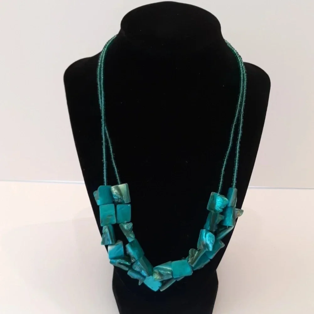 2 strand shell like turquoise necklace.